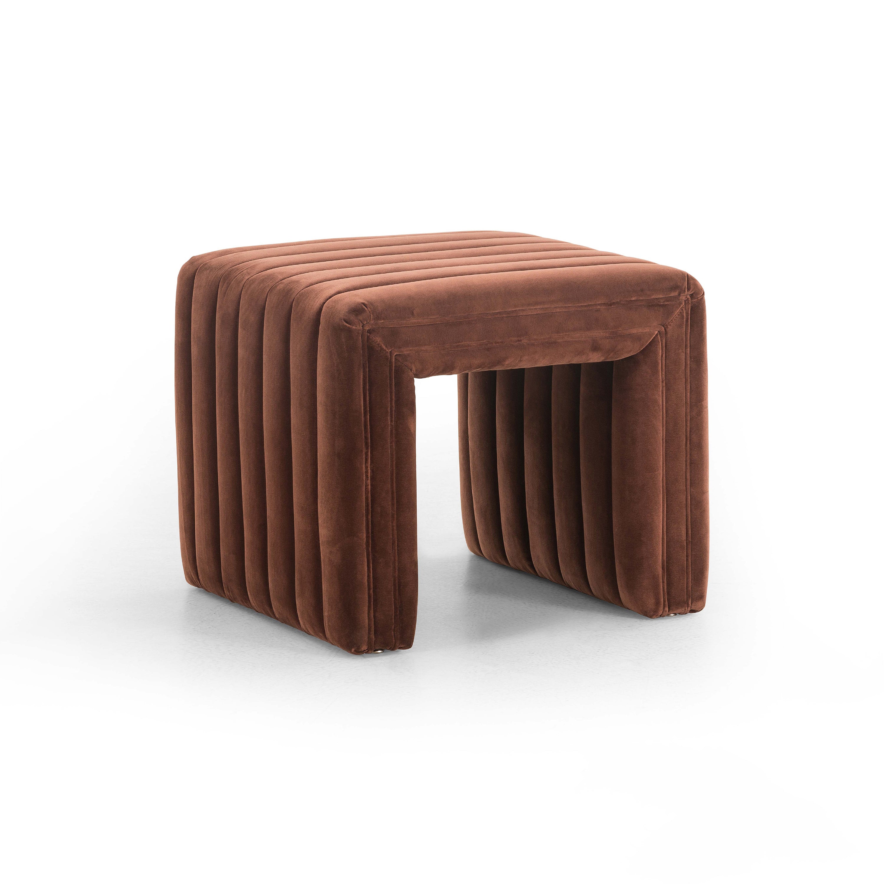 Brown velvet ottoman with vertical stitching and a square shape