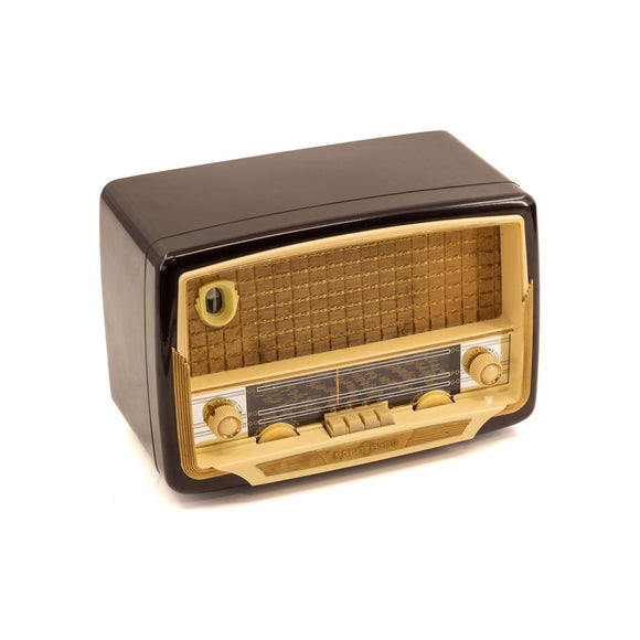 Premium Photo, Old retro radio with on table front gray background