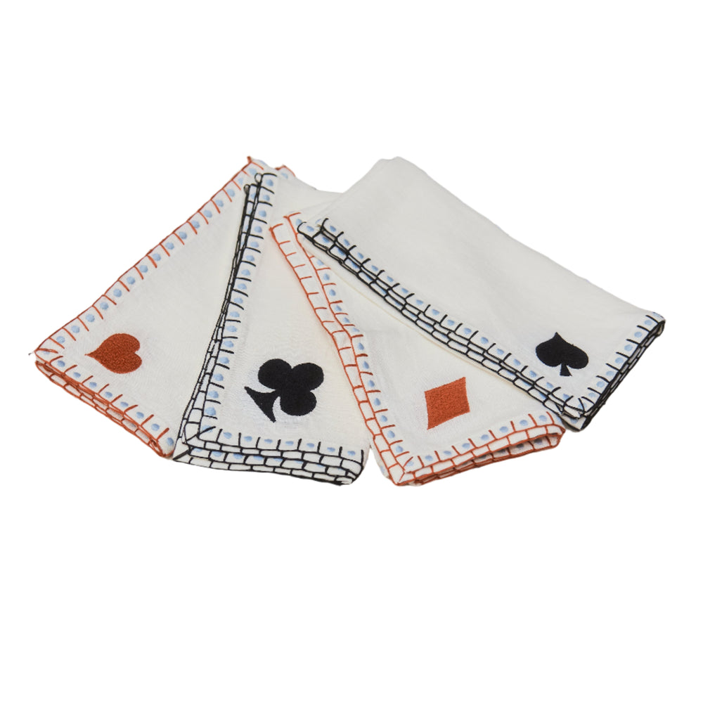 Four playing card suit-themed napkins on a white background