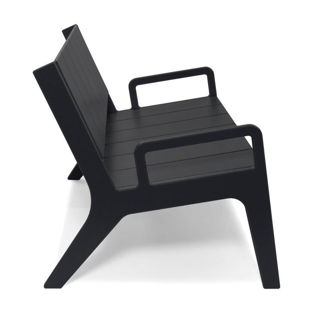 Black armchair with slatted seat and back, metal frame